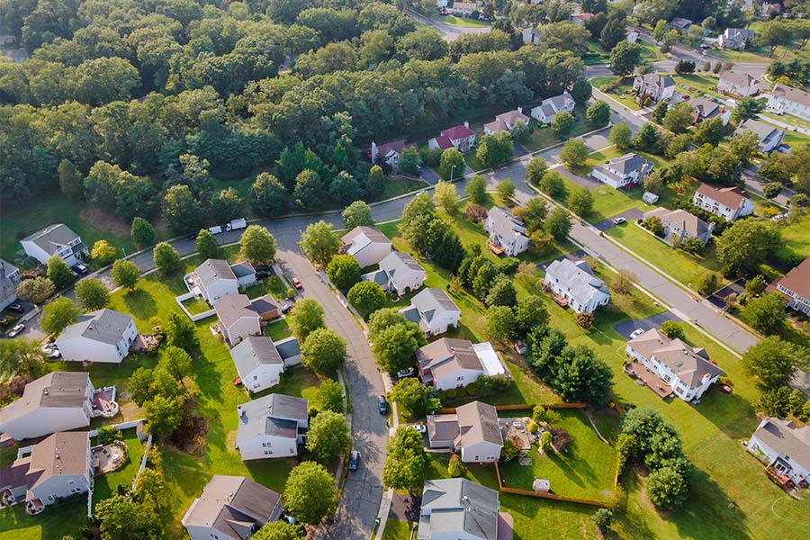 About Our Agency - Aerial View of a Residential Neighborhood in the Suburbs of Columbus Ohio with Green Grass and Trees