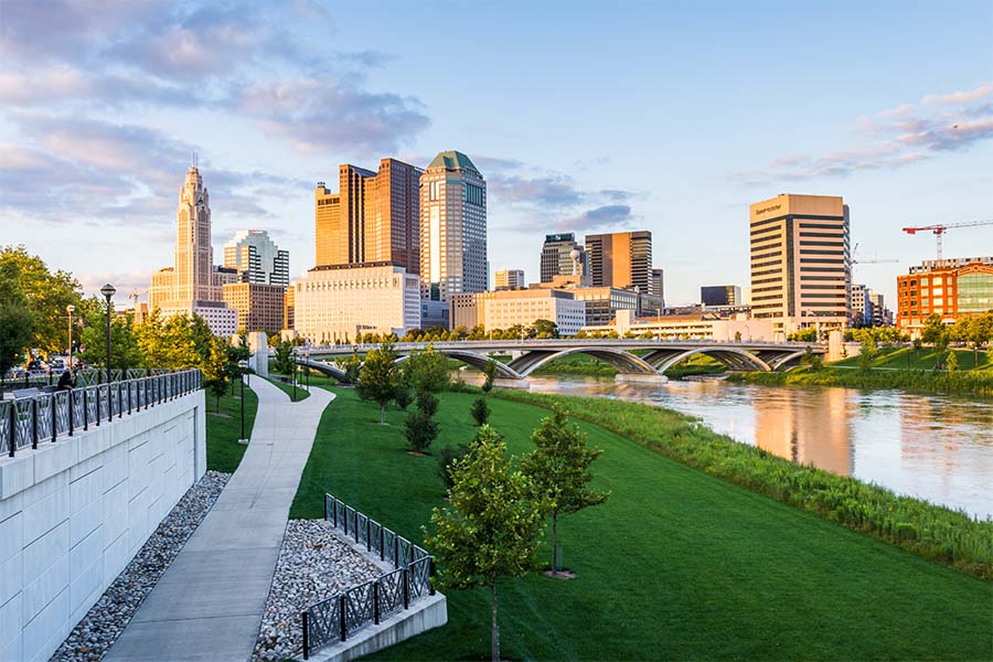 Columbus OH - View of Downtown Columbus Ohio from a Green Park in the City at Sunset